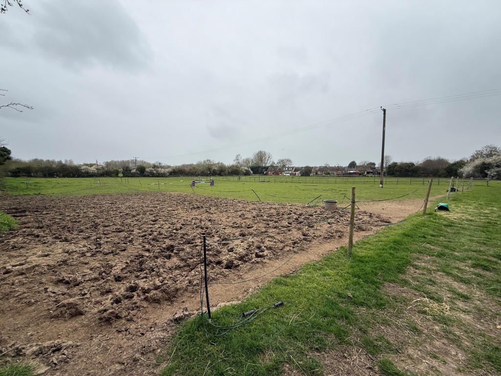 Lot: 36 - TWO PARCELS OF FREEHOLD LAND - Picture in the middle of the south side looking right